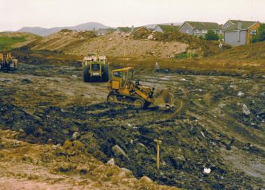 Digging down to the lower road - shows diggers working on the bypass behind the estate