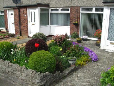 An example of a small packed front garden in Baberton Mains