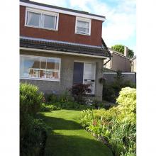 Semi-detached chalet type house with mature garden Semi-detached chalet with mature garden ( front lawn and shrubs)